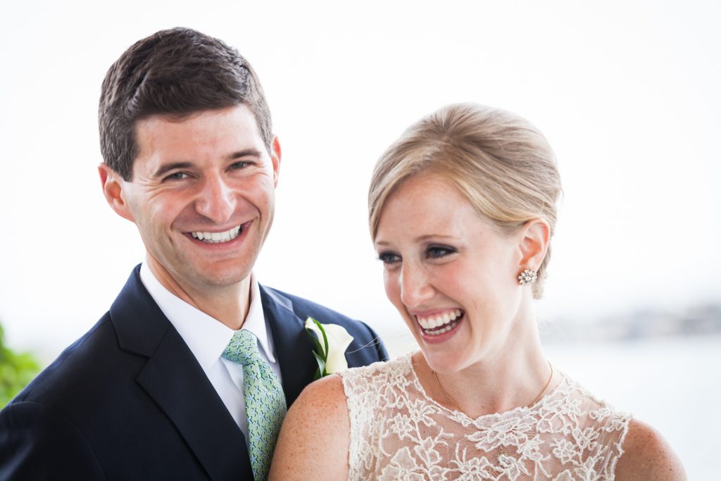 Smiling bride and groom at an American Yacht Club wedding