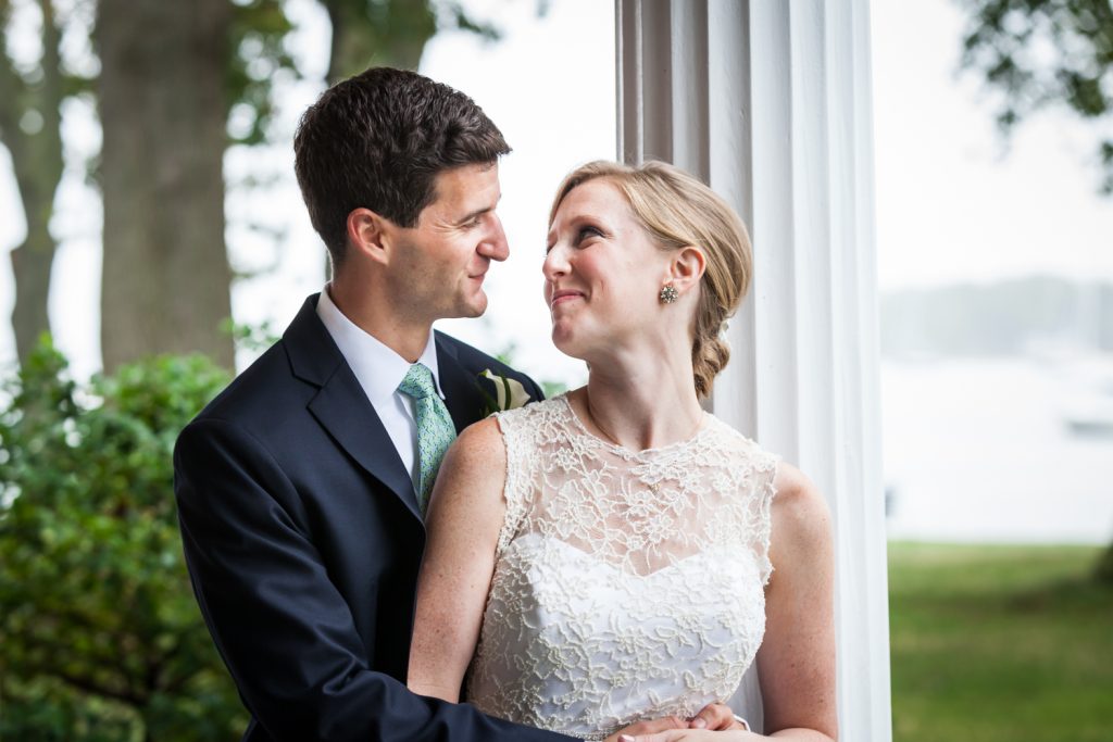 Bride and groom looking at each other at an American Yacht Club wedding