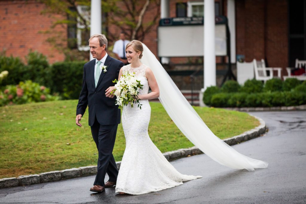 Bride and father walking to ceremony at an American Yacht Club wedding
