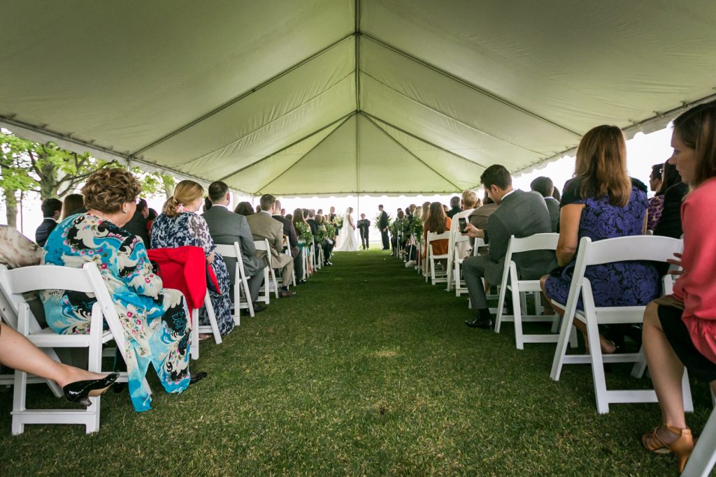 Wide shot of aisle in ceremony tent at an American Yacht Club wedding