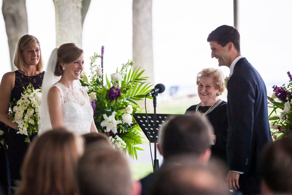 Bride and groom exchanging vows at an American Yacht Club wedding