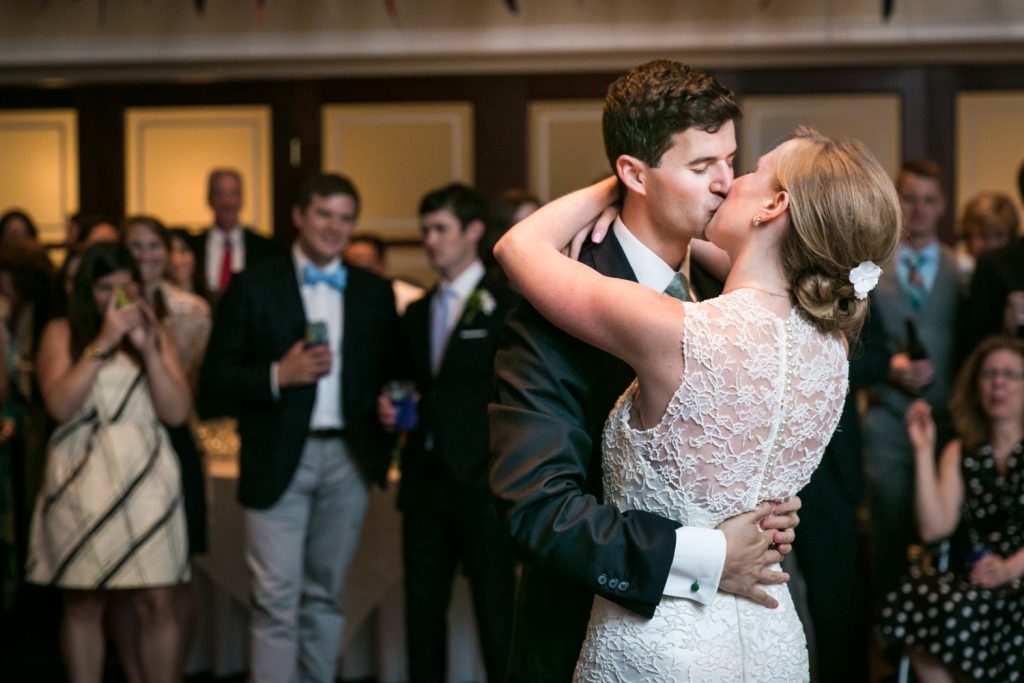 Bride and groom kissing during first dance at an American Yacht Club wedding