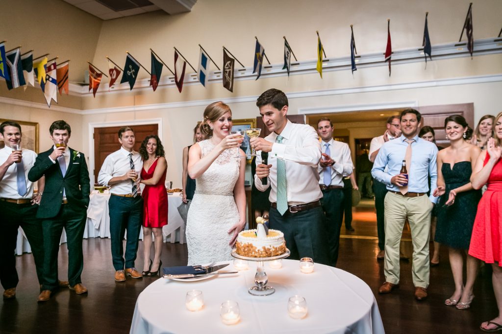Bride and groom toasting champagne glasses at an American Yacht Club wedding
