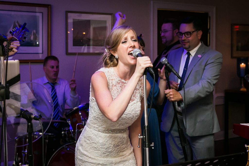 Bride singing into a microphone
