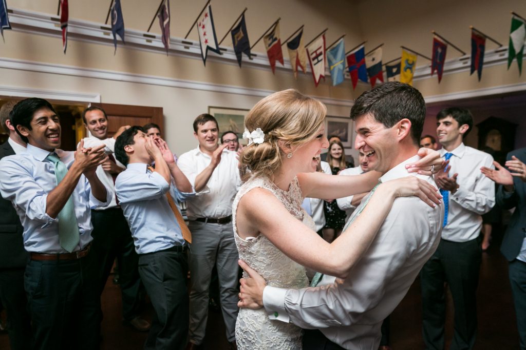 Bride and groom dancing in front of guests at an American Yacht Club wedding