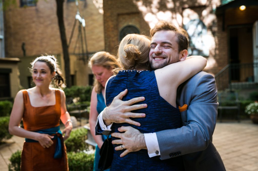 Groom hugging woman after Oratory of St. Boniface ceremony