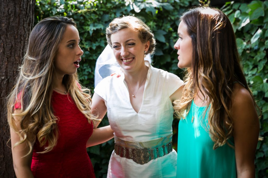 Bride laughing with two female guests during Farm on Adderley wedding reception