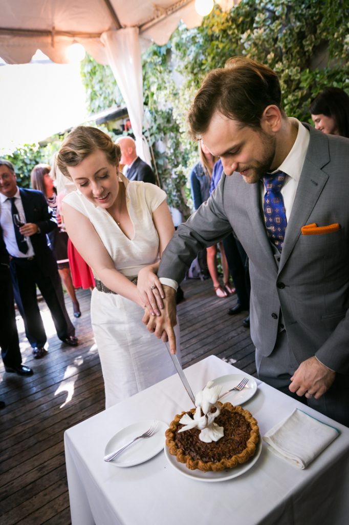 Bride and groom cutting pie during Farm on Adderley wedding reception