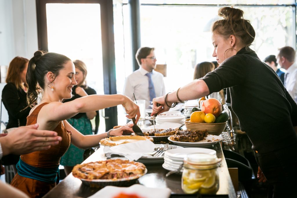 Waitress serving guest a slice of pie during Farm on Adderley wedding reception