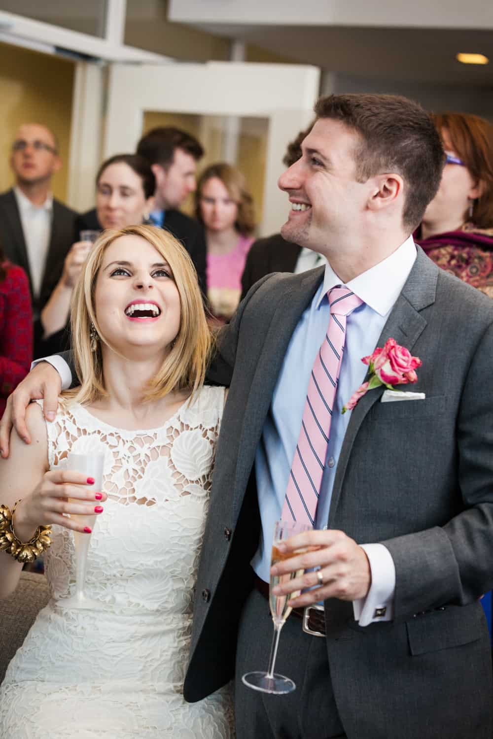 Bride and groom laughing during cocktail hour