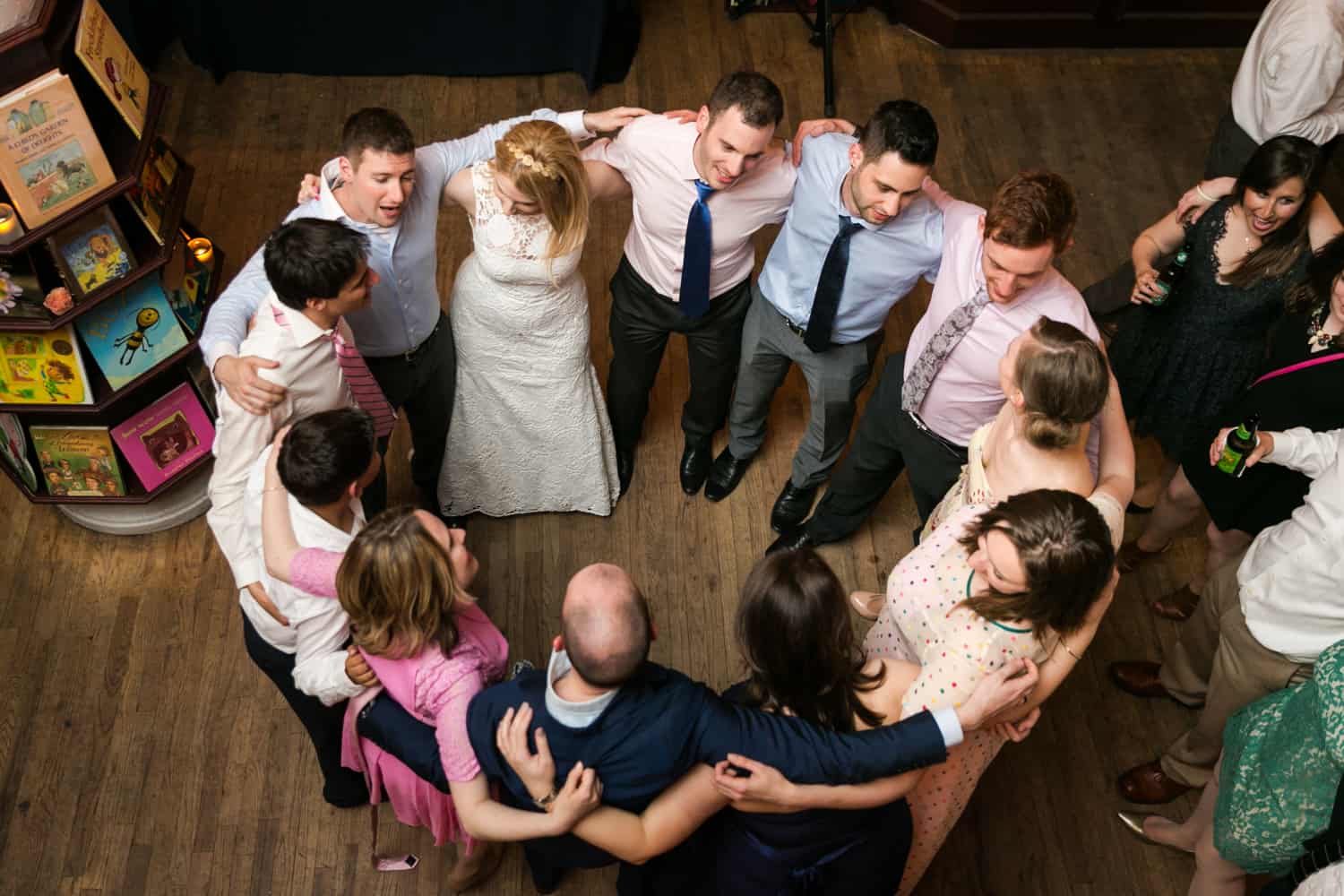 Guests hugging in circle at a Housing Works wedding