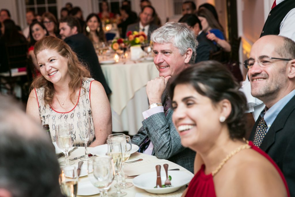 Guests laughing at tables at an India House wedding