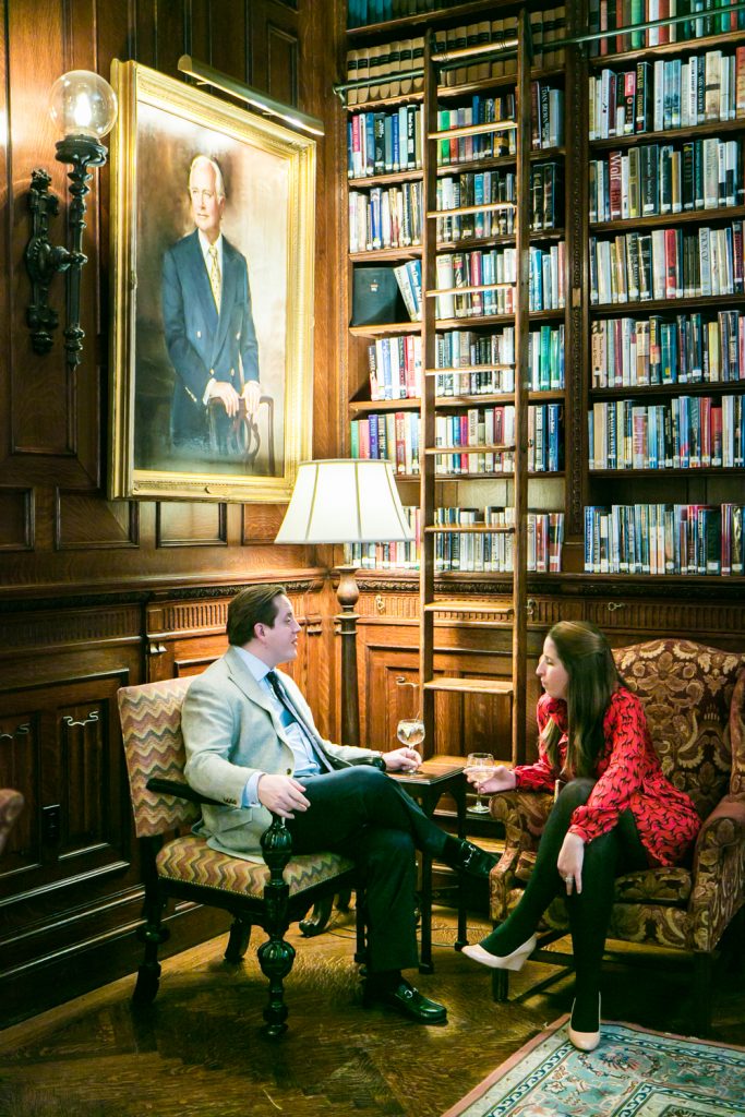 Two seated guests talking at a Lotos Club engagement party