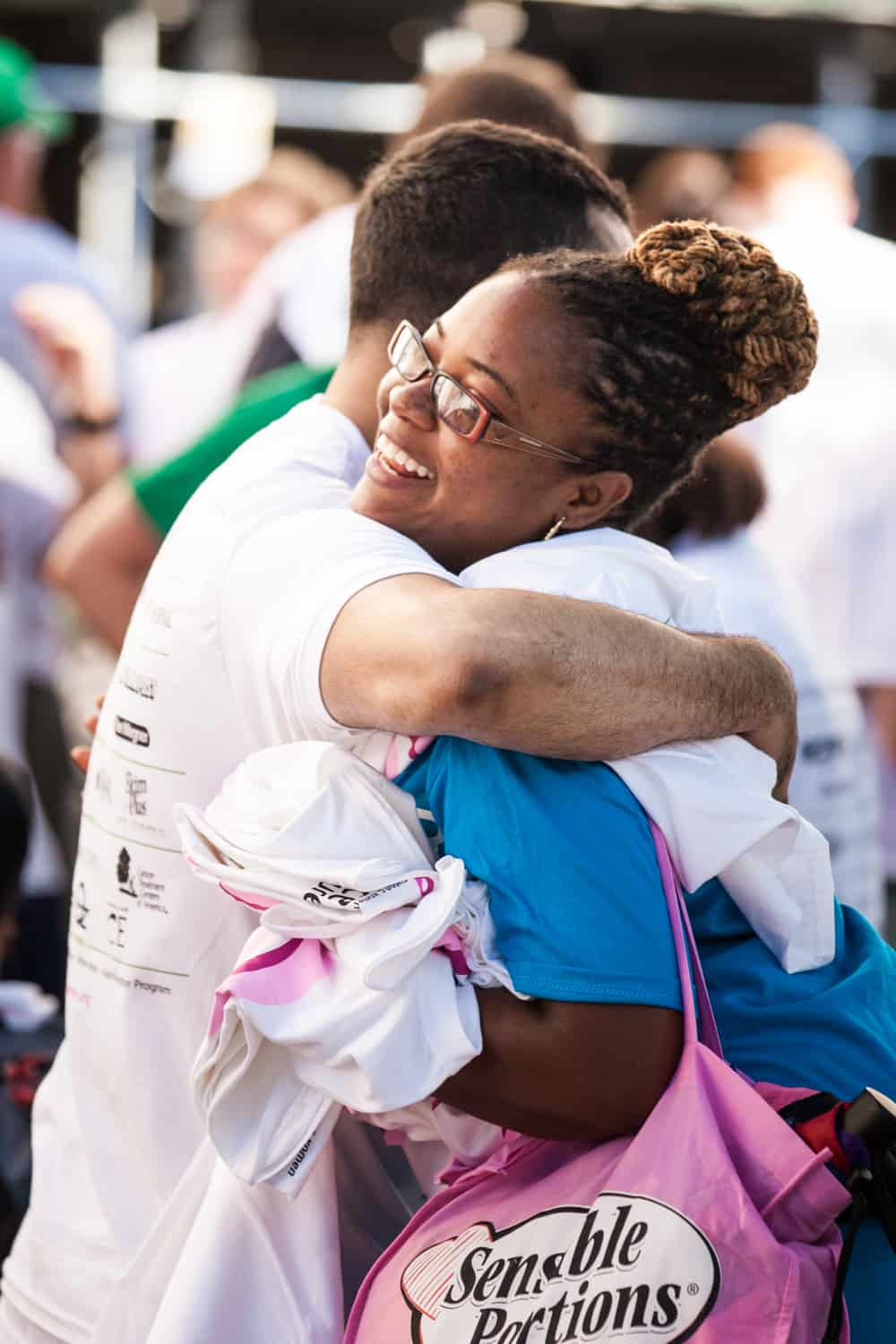 NYC Race for the Cure photos of African American woman hugging man