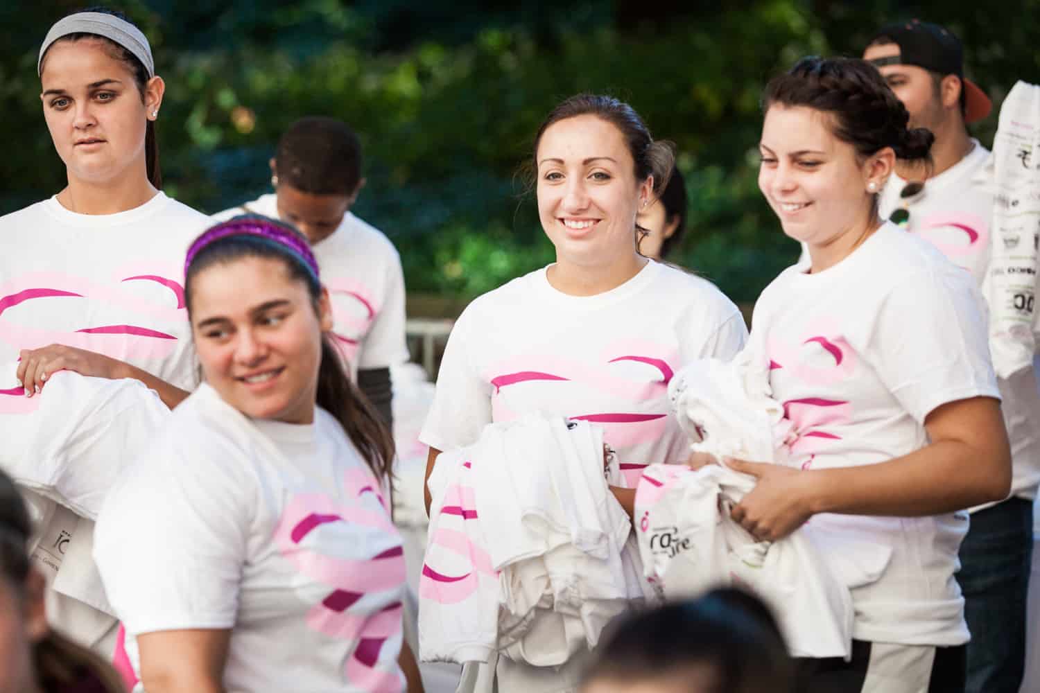 NYC Race for the Cure photos of group of runners wearing matching white t-shirts
