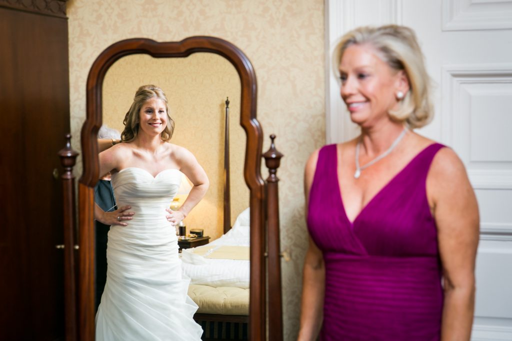 Mother seeing bride in dress for the first time before a University Club wedding