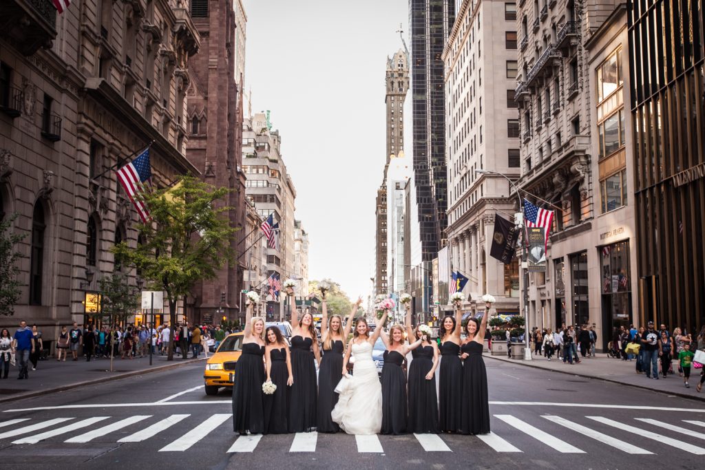 Bride and bridesmaids in the crosswalk of Fifth Avenue before a University Club wedding
