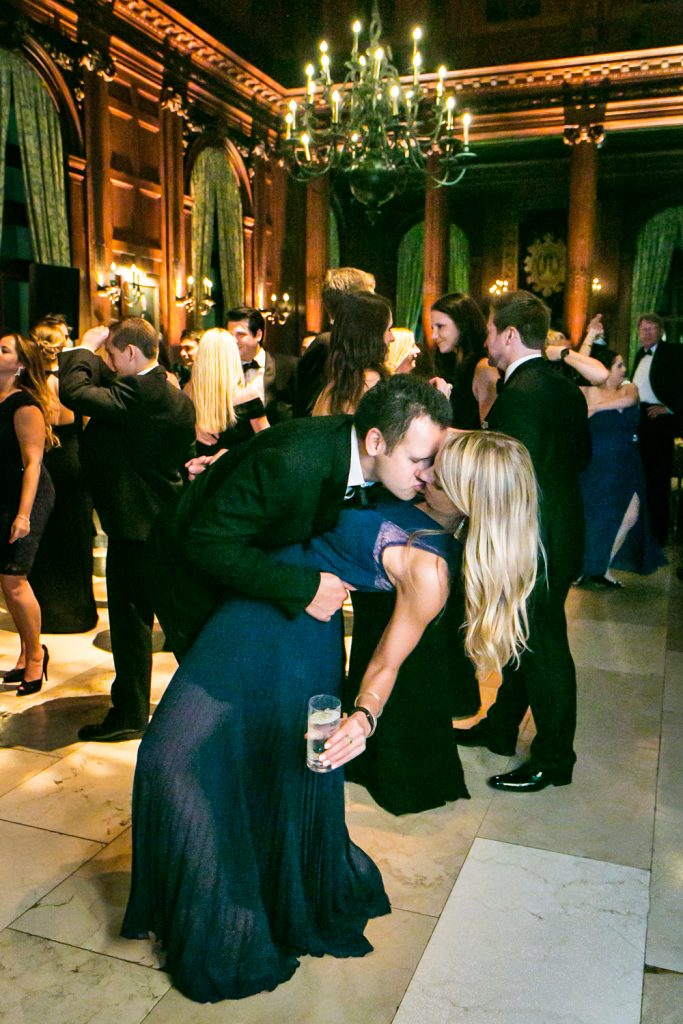 Couple kissing deeply on the dance floor at a University Club wedding
