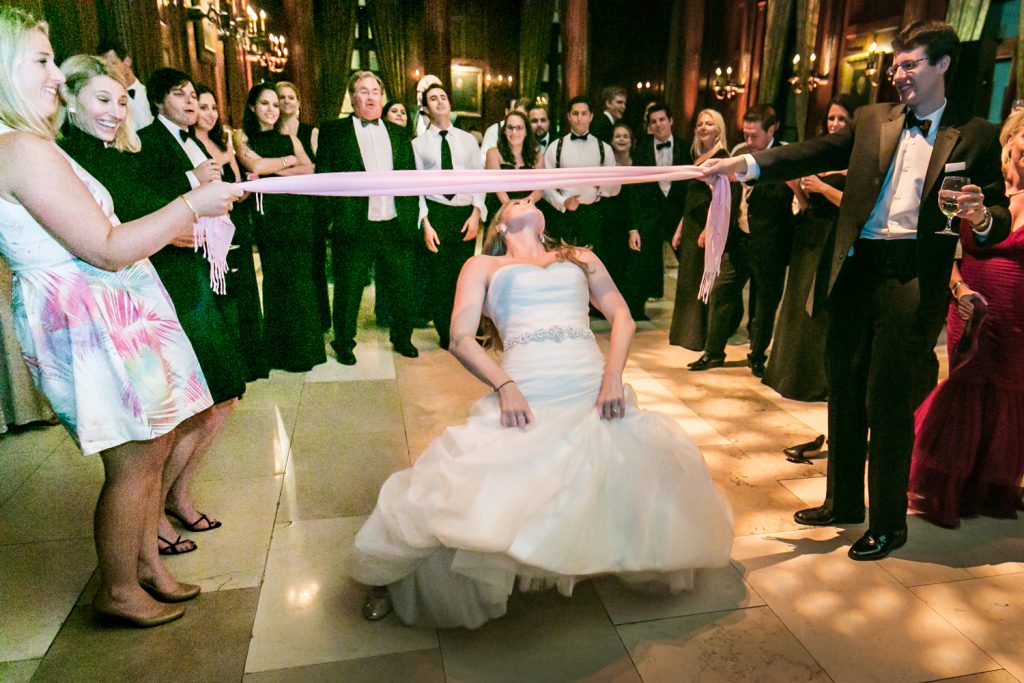 Bride dancing the limbo at a University Club wedding