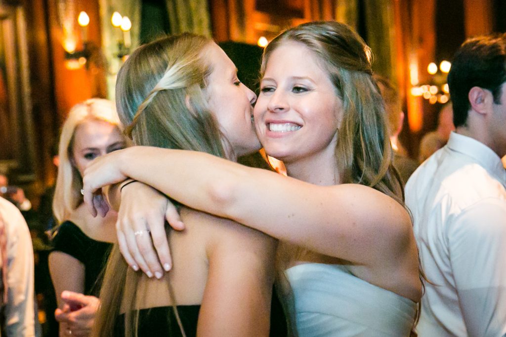 Bride hugging sister during a University Club wedding