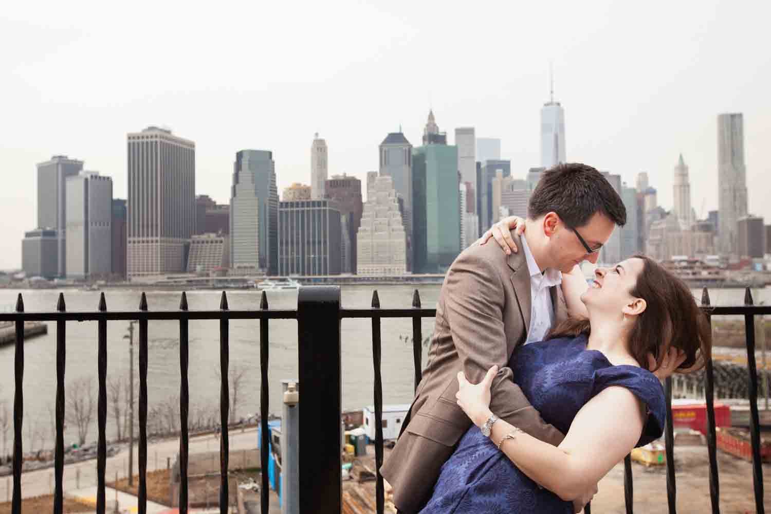Couple dancing on Brooklyn Promenade with NYC skyline in background