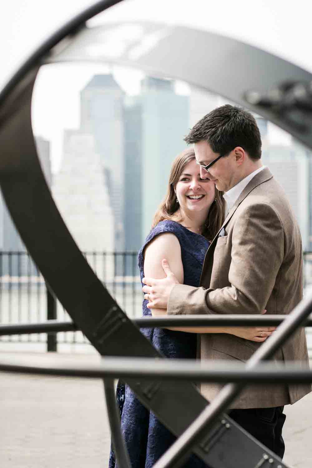 View through Brooklyn Promenade sculpture of couple hugging