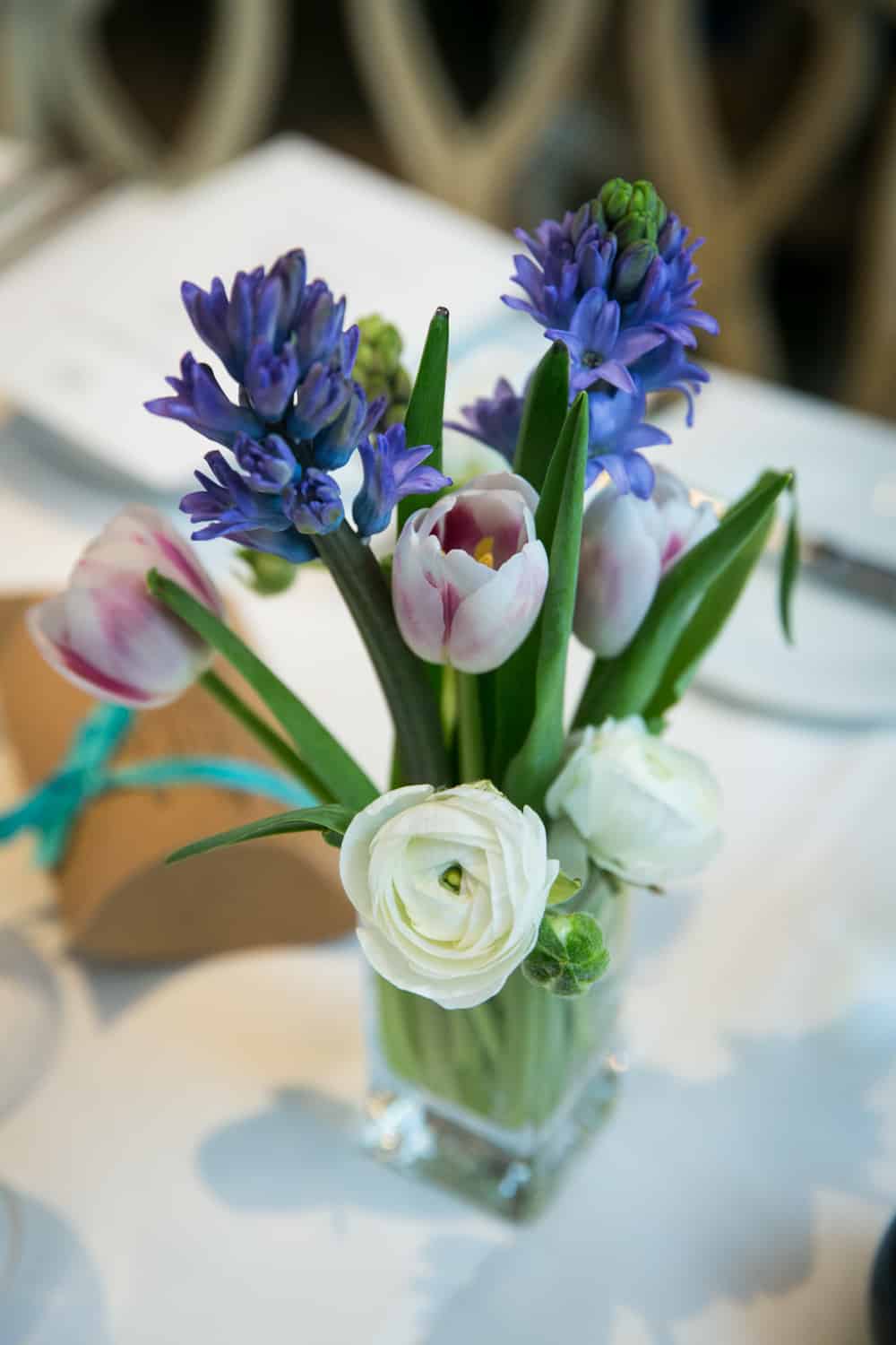 Blue and white flower arrangement at a Bergdorf Goodman wedding reception