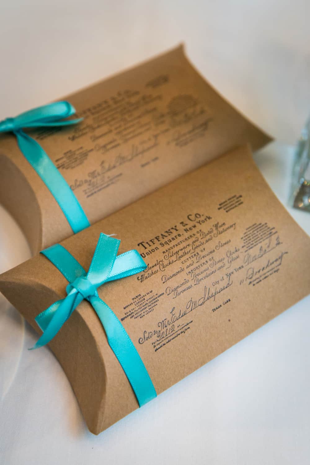Two guest favor packets from Tiffany's at a Bergdorf Goodman wedding reception