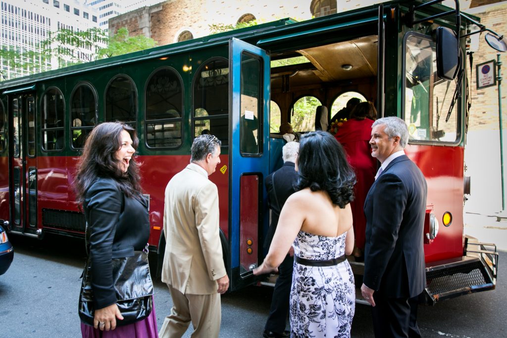 Guests getting on trolley after a Waldorf Astoria wedding