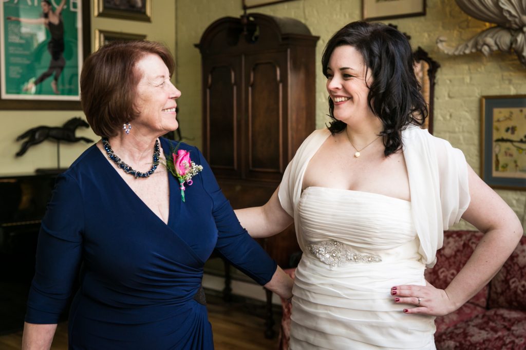 Bride and mother laughing at an Alger House wedding ceremony