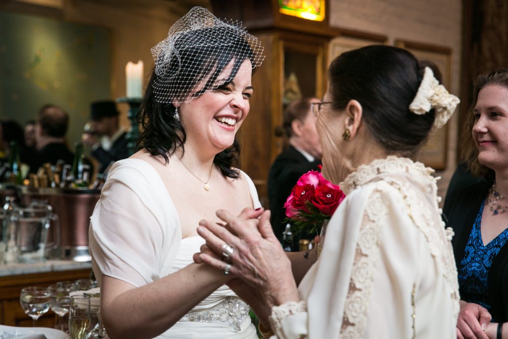 Bride greeting guest at Alger House wedding reception