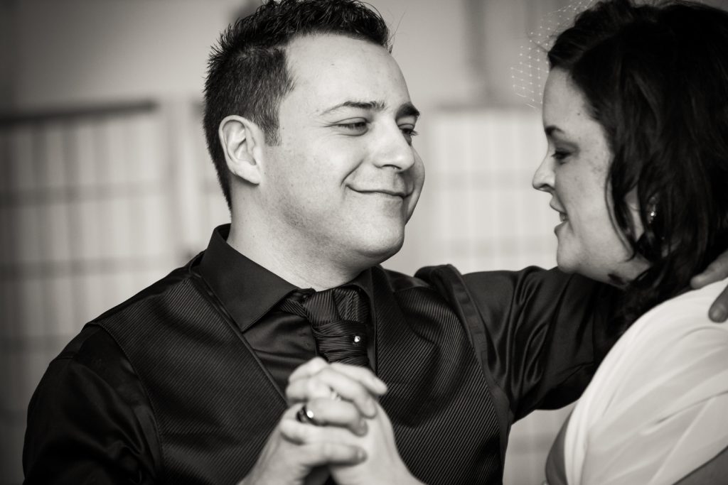 Black and white photo of bride and groom during first dance at Alger House wedding reception