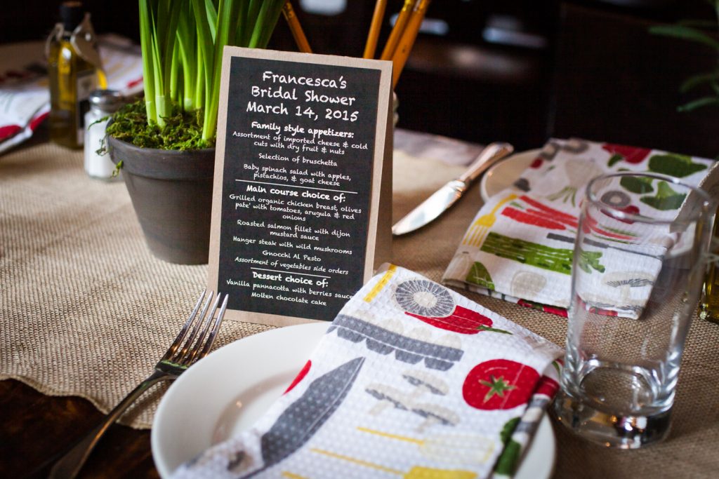 Table setting with menu card and kitchen towel