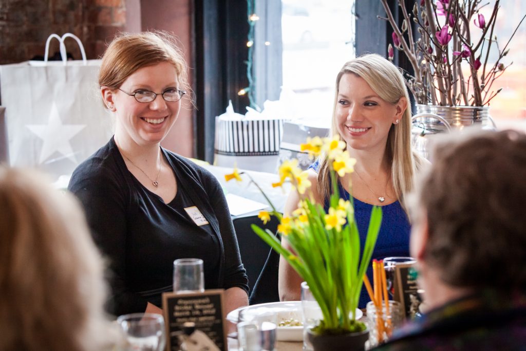 Two women smiling at a NYC bridal shower