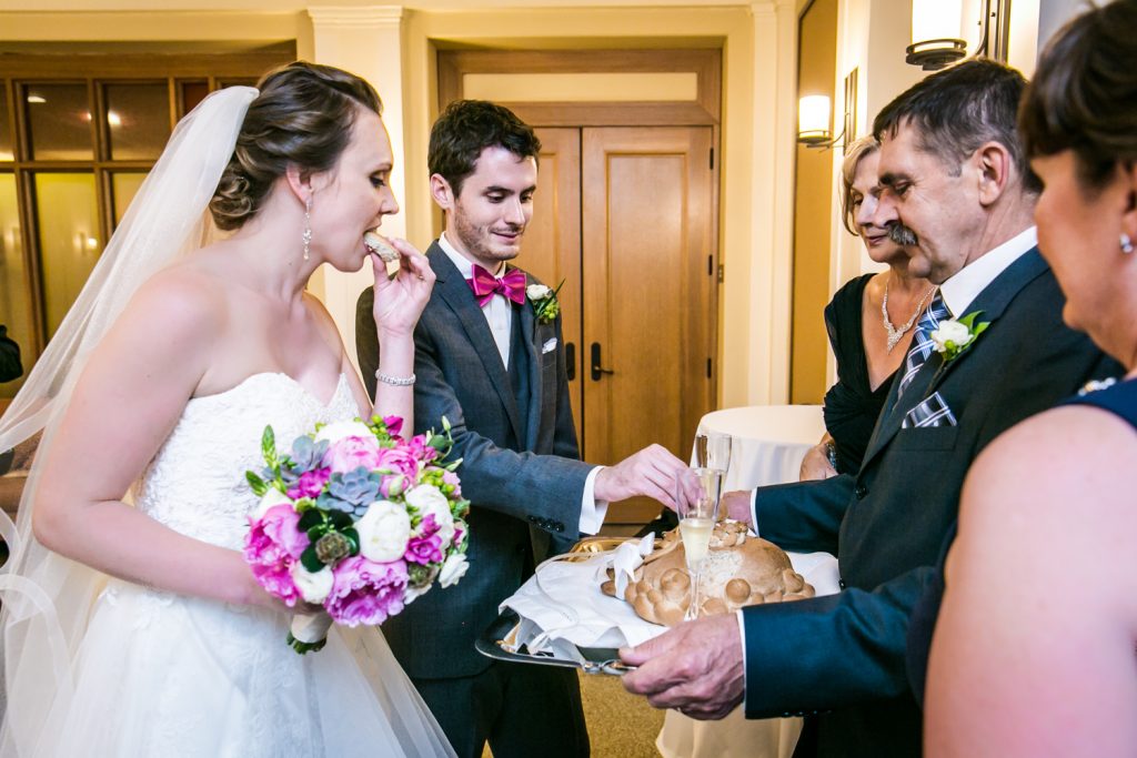 Bride and groom accepting bread and salt from bride's parents