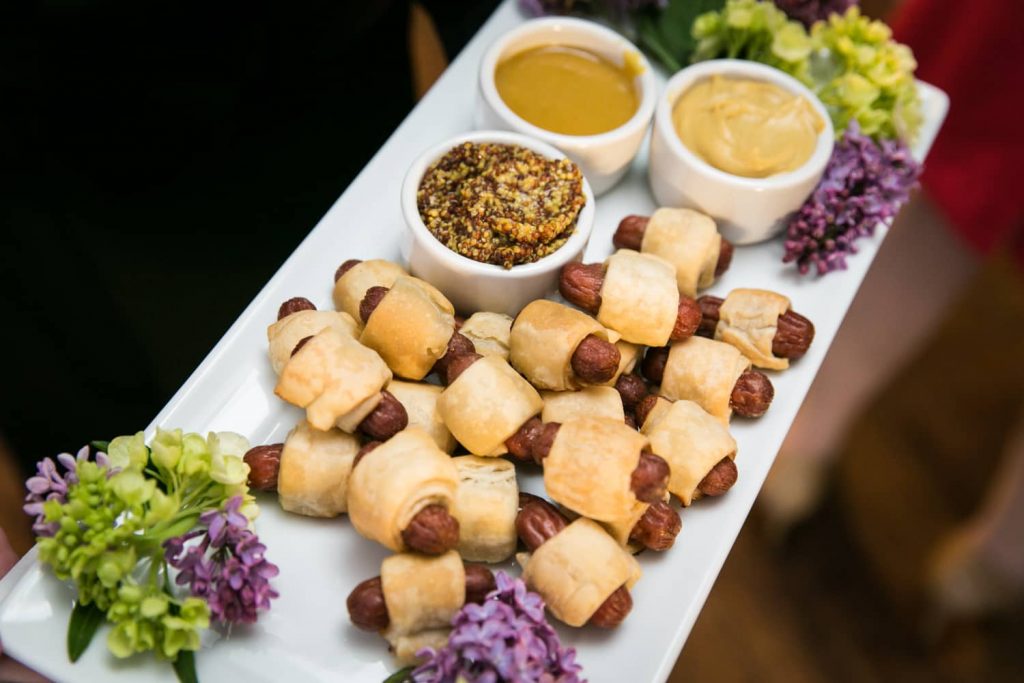 Plate of pigs in a blanket with three dips
