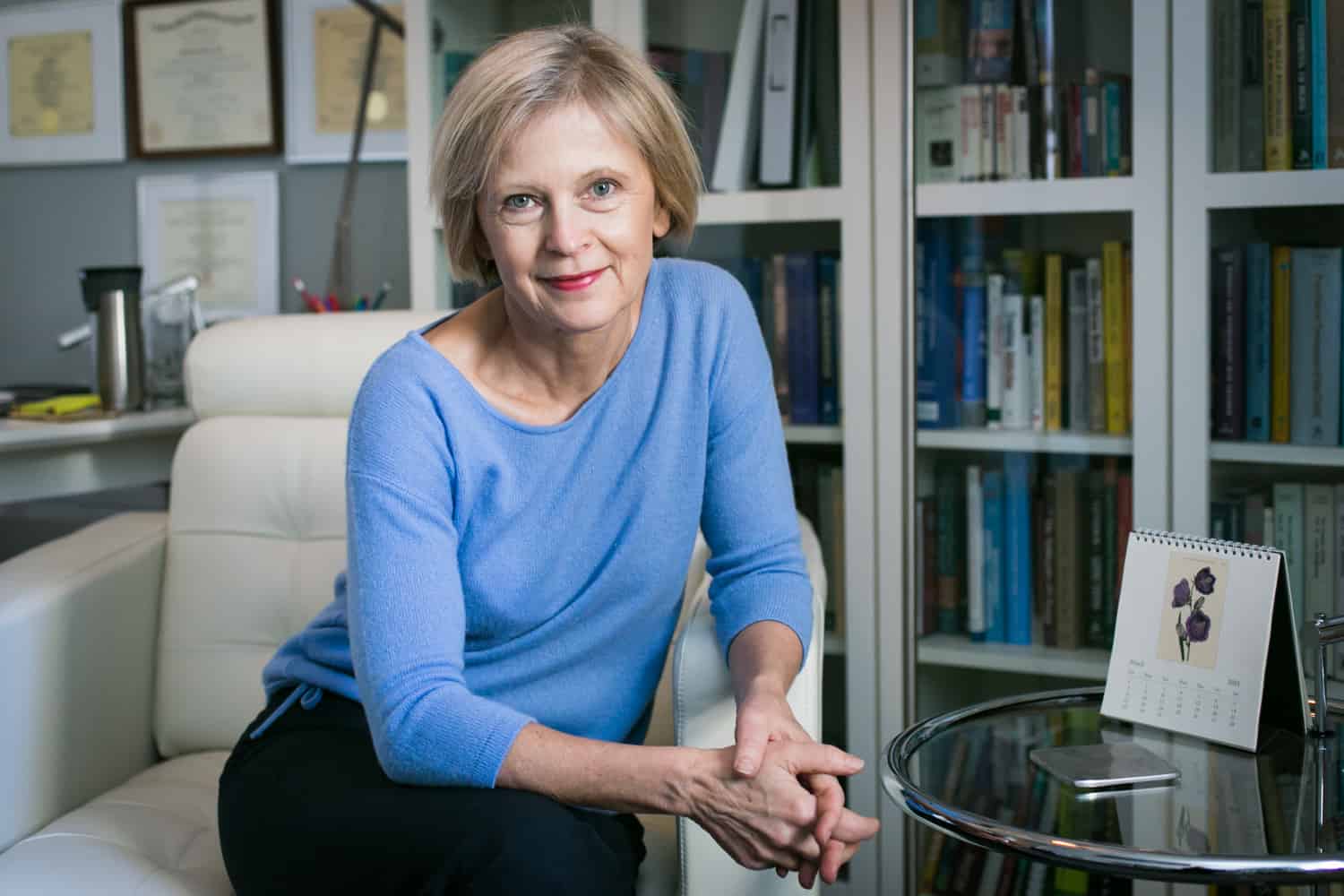 Professional portraits of a psychiatrist sitting in her office