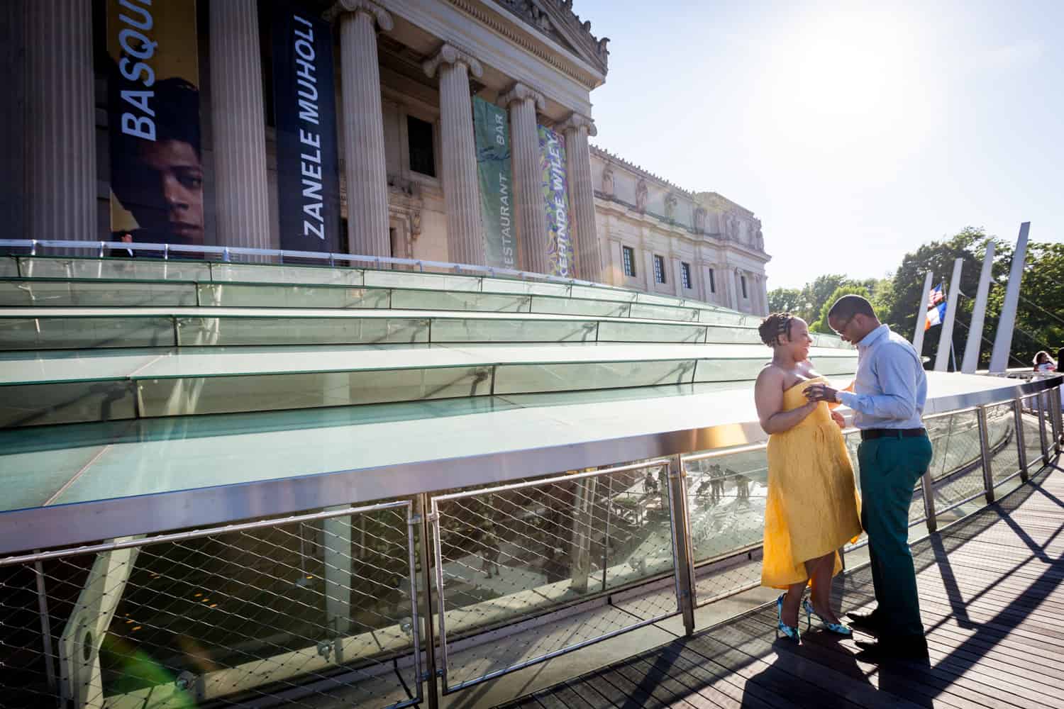 Couple dancing on roof of Brooklyn Museum at a Brooklyn Museum engagement shoot