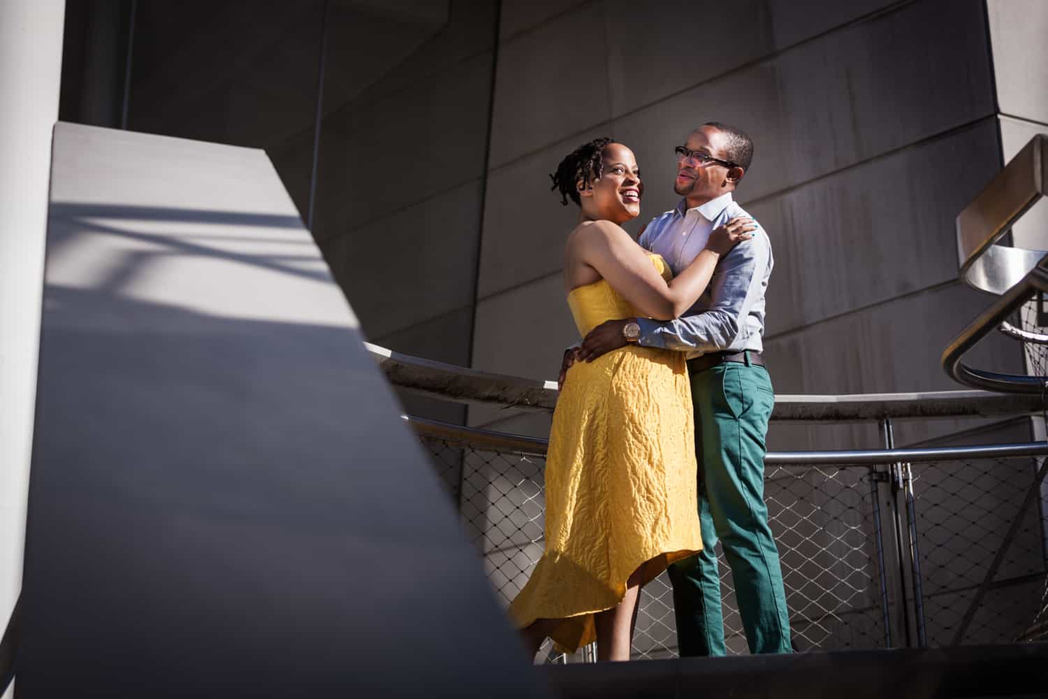 Couple standing on Brooklyn Museum steps at a Brooklyn Museum engagement shoot