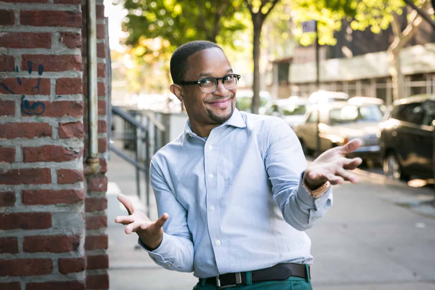 African American man wearing glasses and making funny face