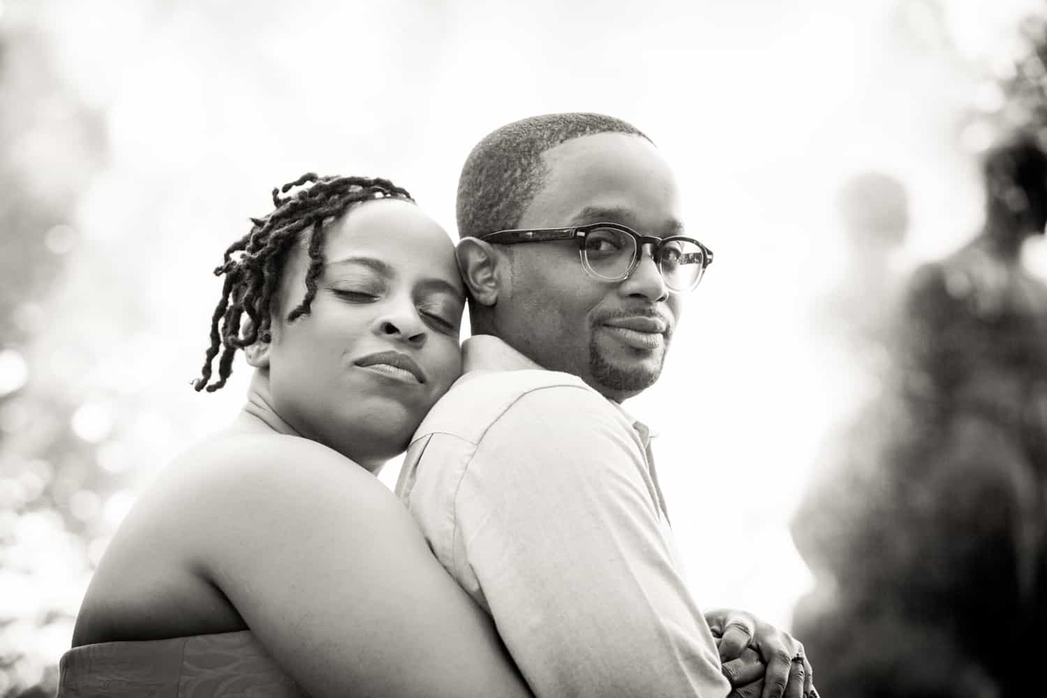 Black and white photo of African American couple hugging