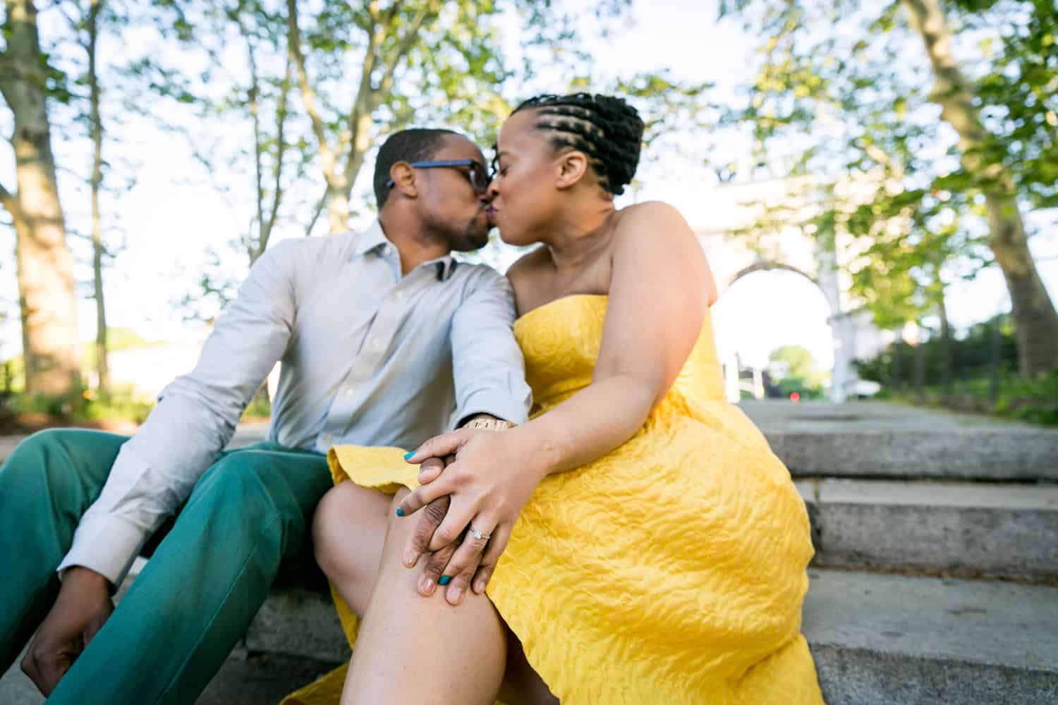 African American couple kissing on steps of Grand Army Plaza