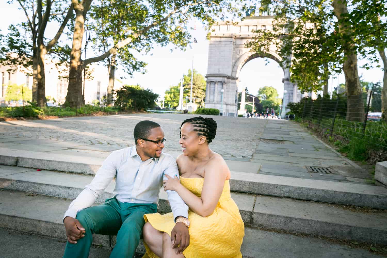 African American couple sitting on steps of Grand Army Plaza