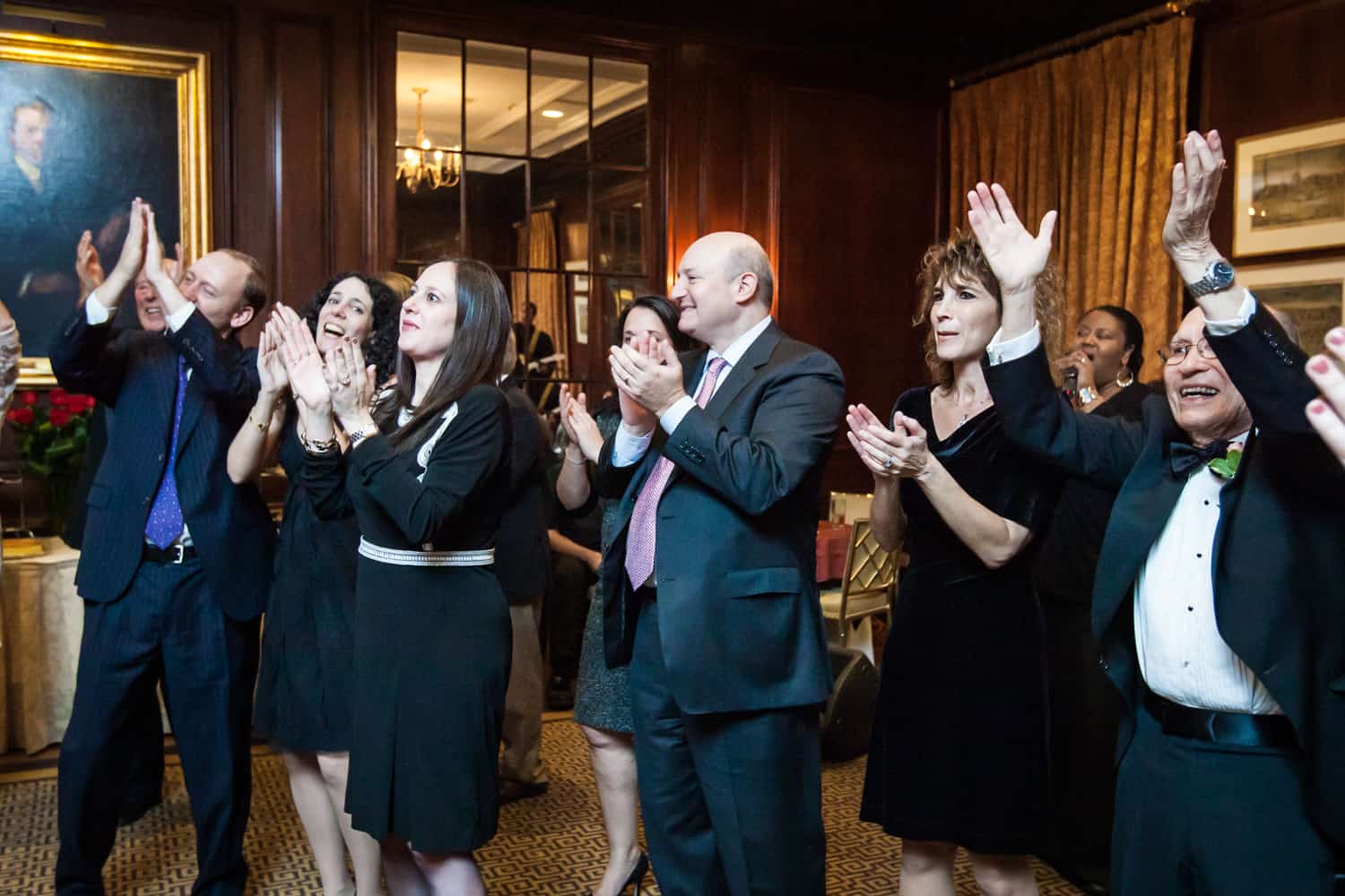 Guests clapping at Harvard Club wedding reception