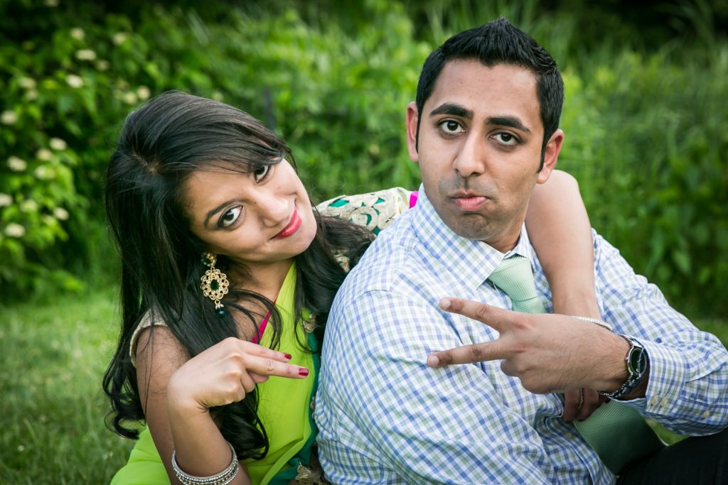 Couple making funny faces in Central Park for an article on NYC engagement shoot ideas