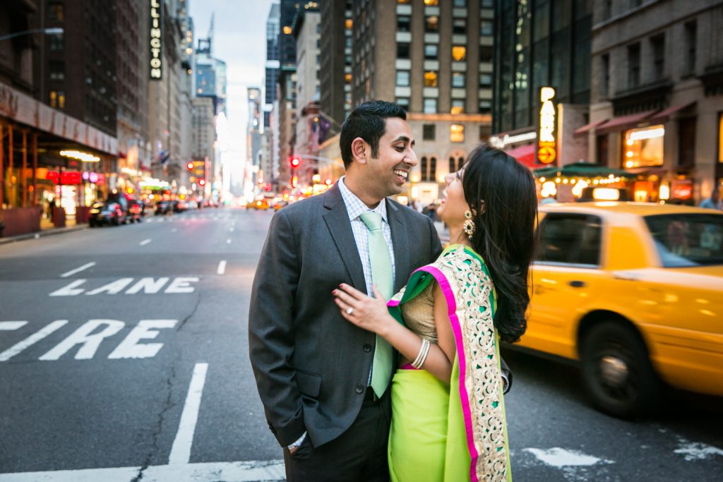 Couple looking at each other in the crosswalk of a NYC street