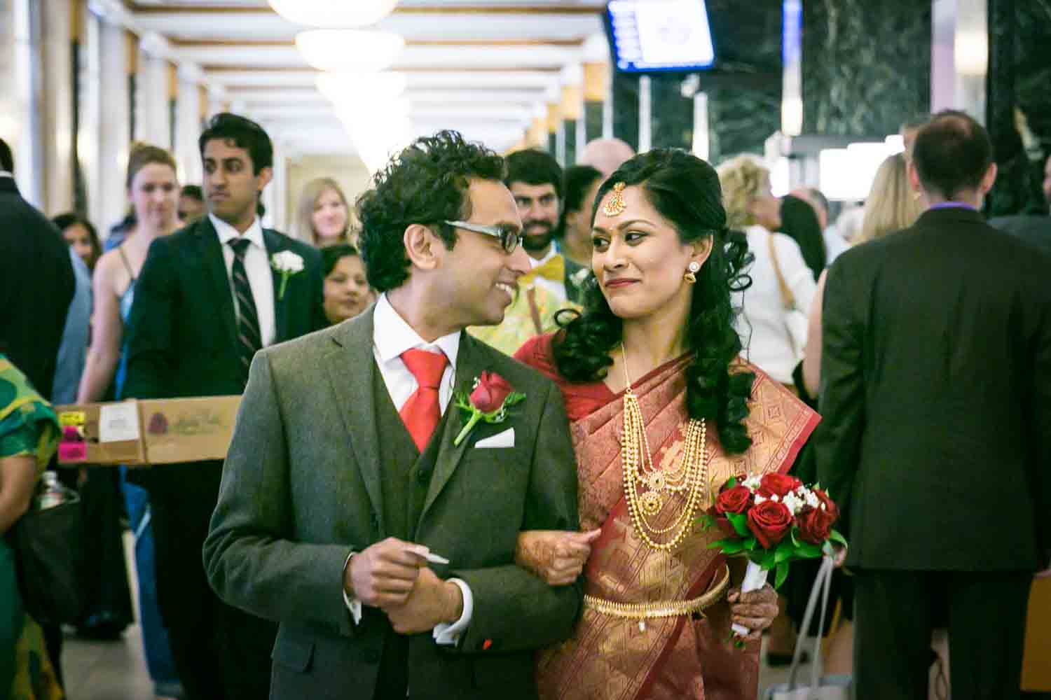 Indian bride and groom walking out of City Clerk's office at a NYC City Hall Indian wedding