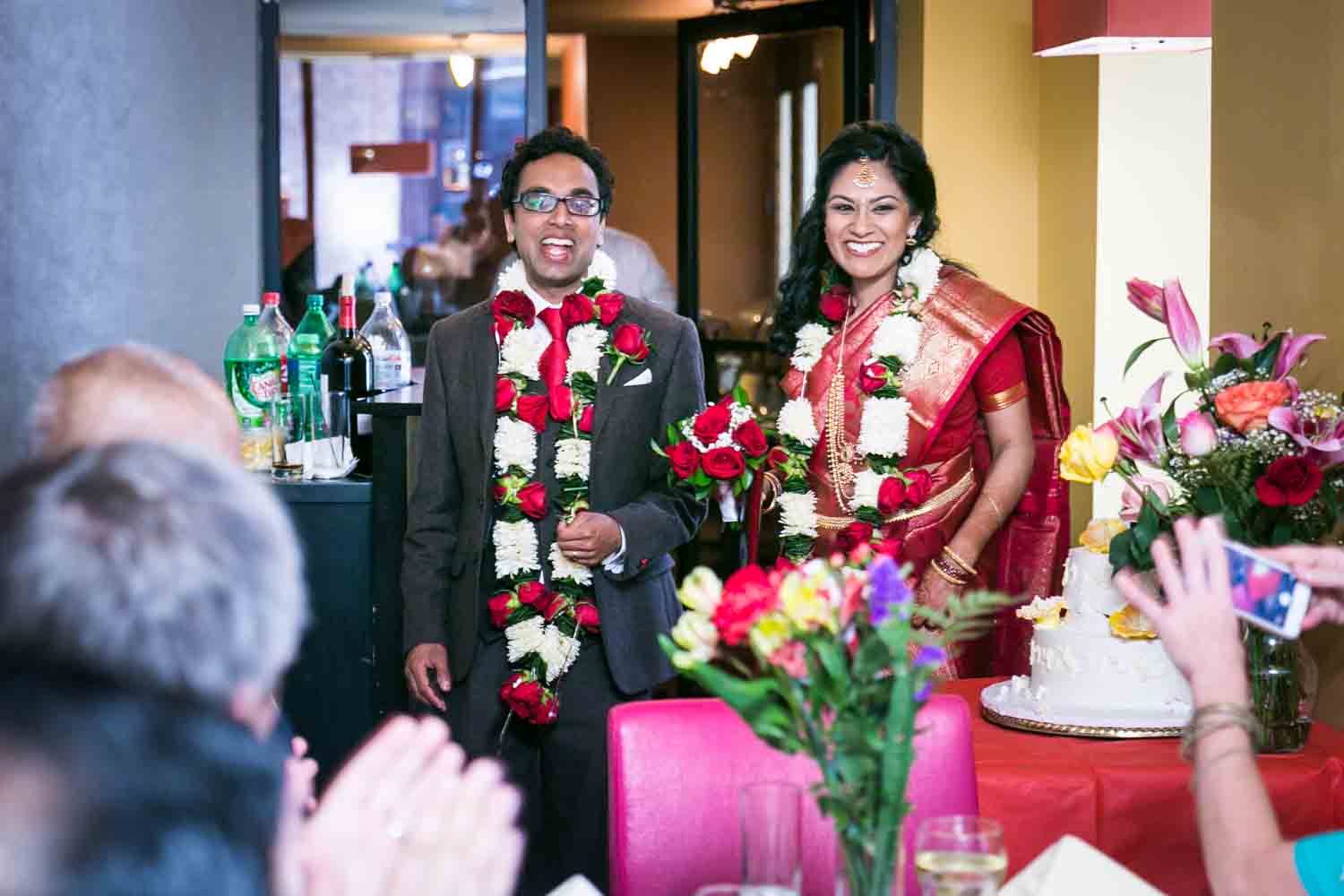 Bride and groom entering reception at a NYC City Hall Indian wedding