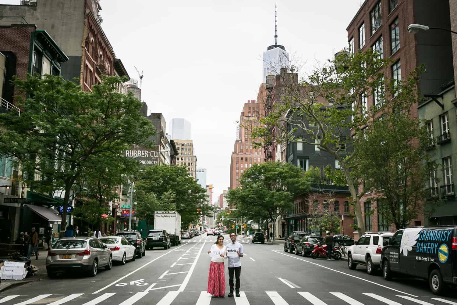 Couple standing in crosswalk of NYC street