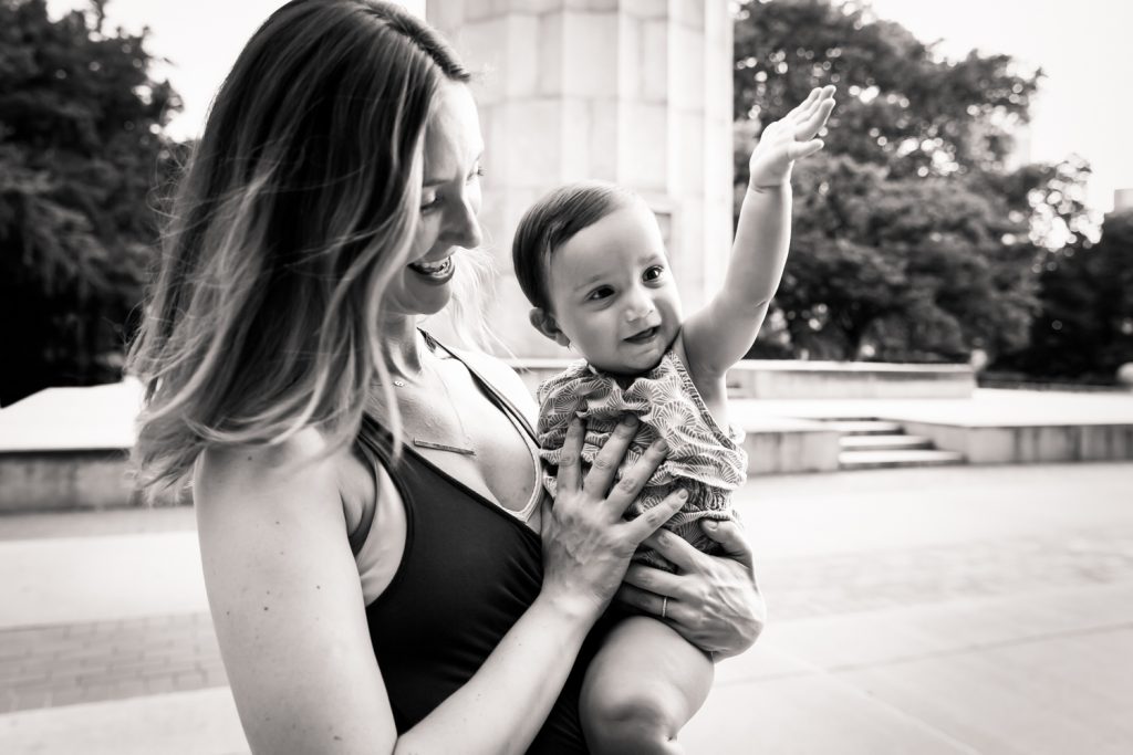 Black and white photo of mother holding baby for a Fort Greene Park family portrait